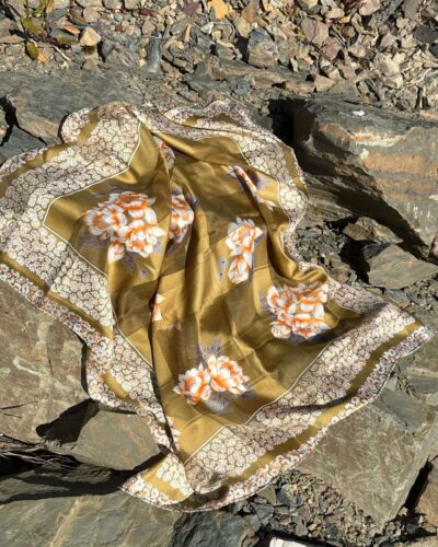 Olive green scarf with daisy pattern