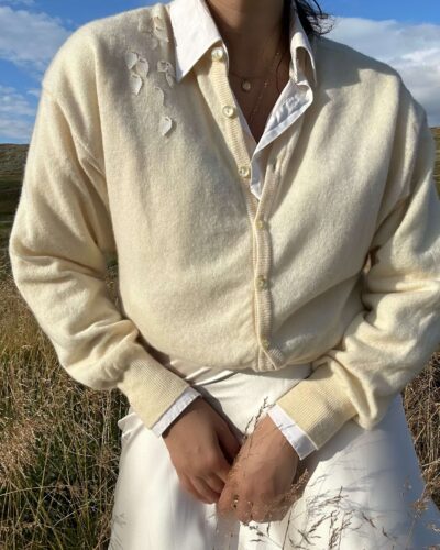 Soft creamy woolen cardigan with applique