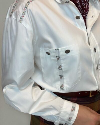 Country style blouse with silver buttons and floral embroidery