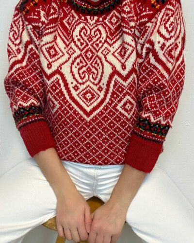 Red woolen sweater with scandinavian pattern