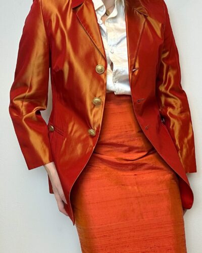Burnt orange blazer with massive golden buttons
