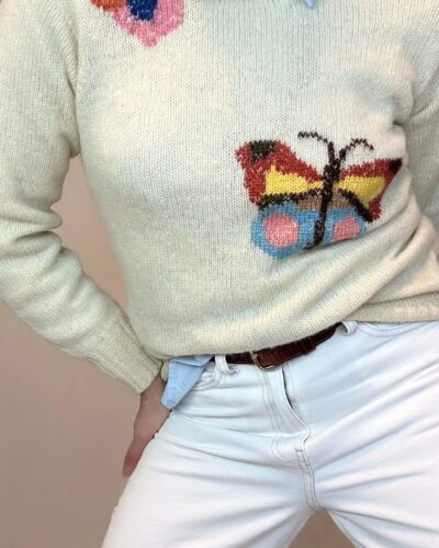 Hand-knitted wheat beige sweater with a butterfly