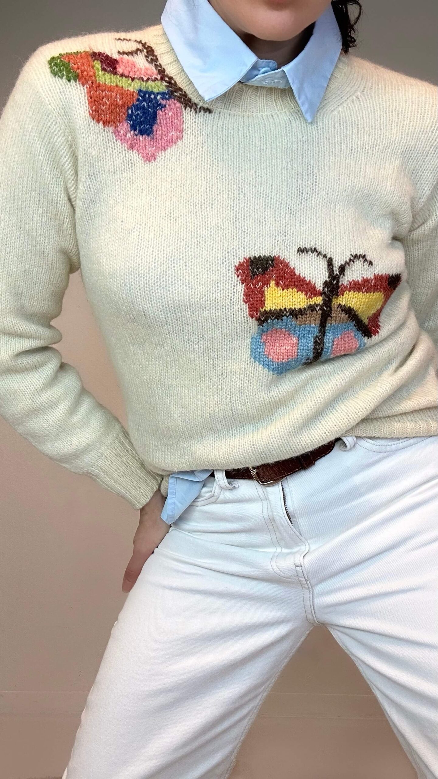 Hand-knitted wheat beige sweater with a butterfly
