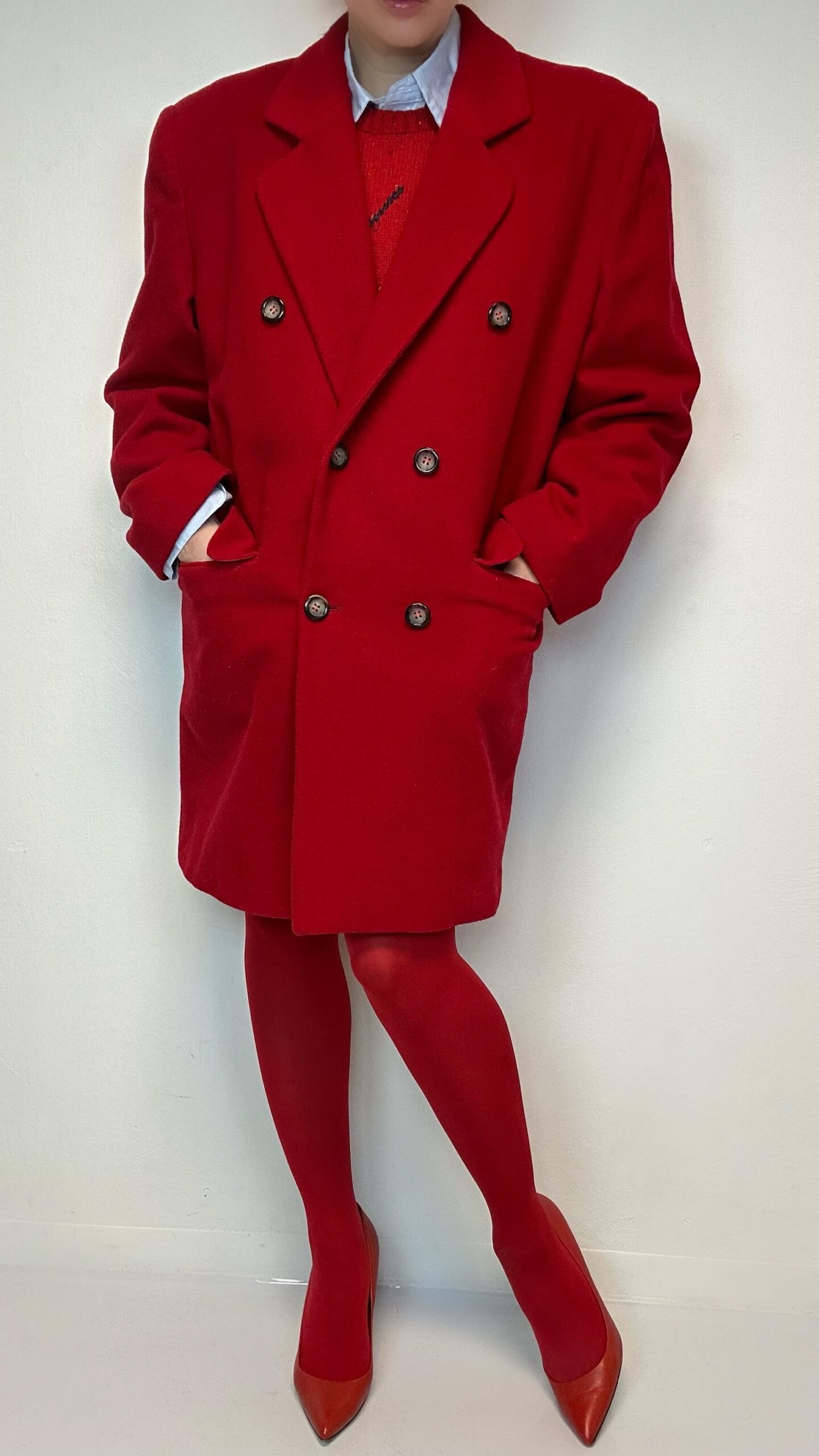 Red woolen coat with bold shoulders