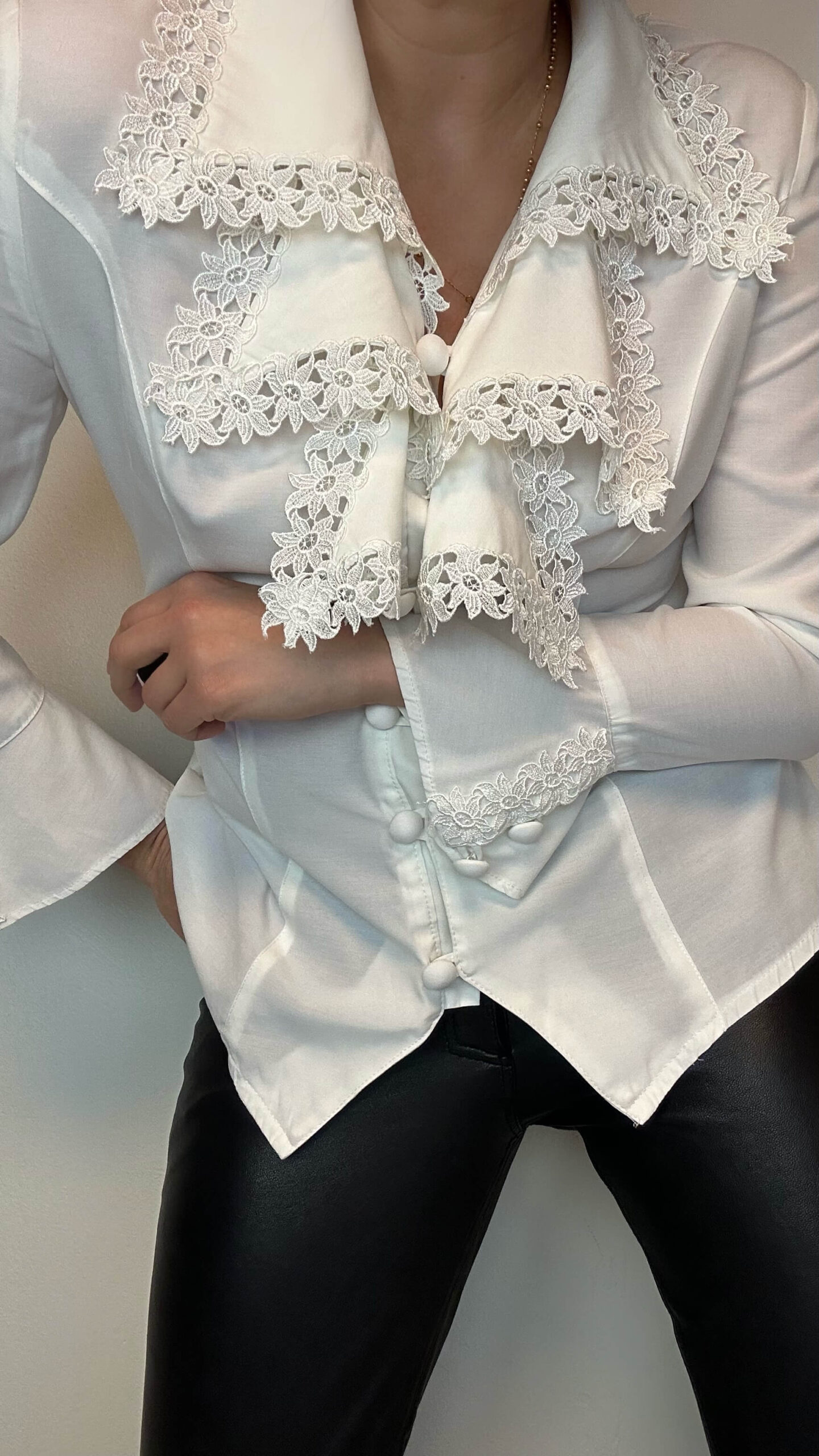 Romantic blouse with a statement cascade collar