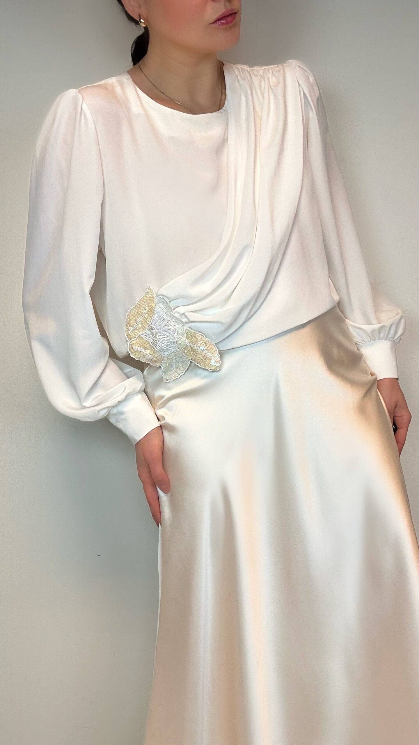 Ivory beige blouse with a sequined application