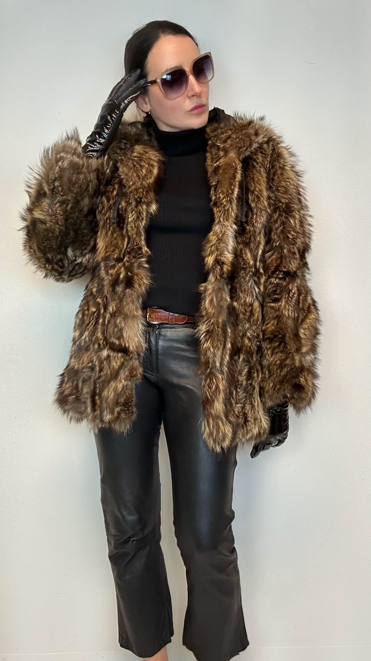 Fluffy genuine raccoon fur jacket with a hood