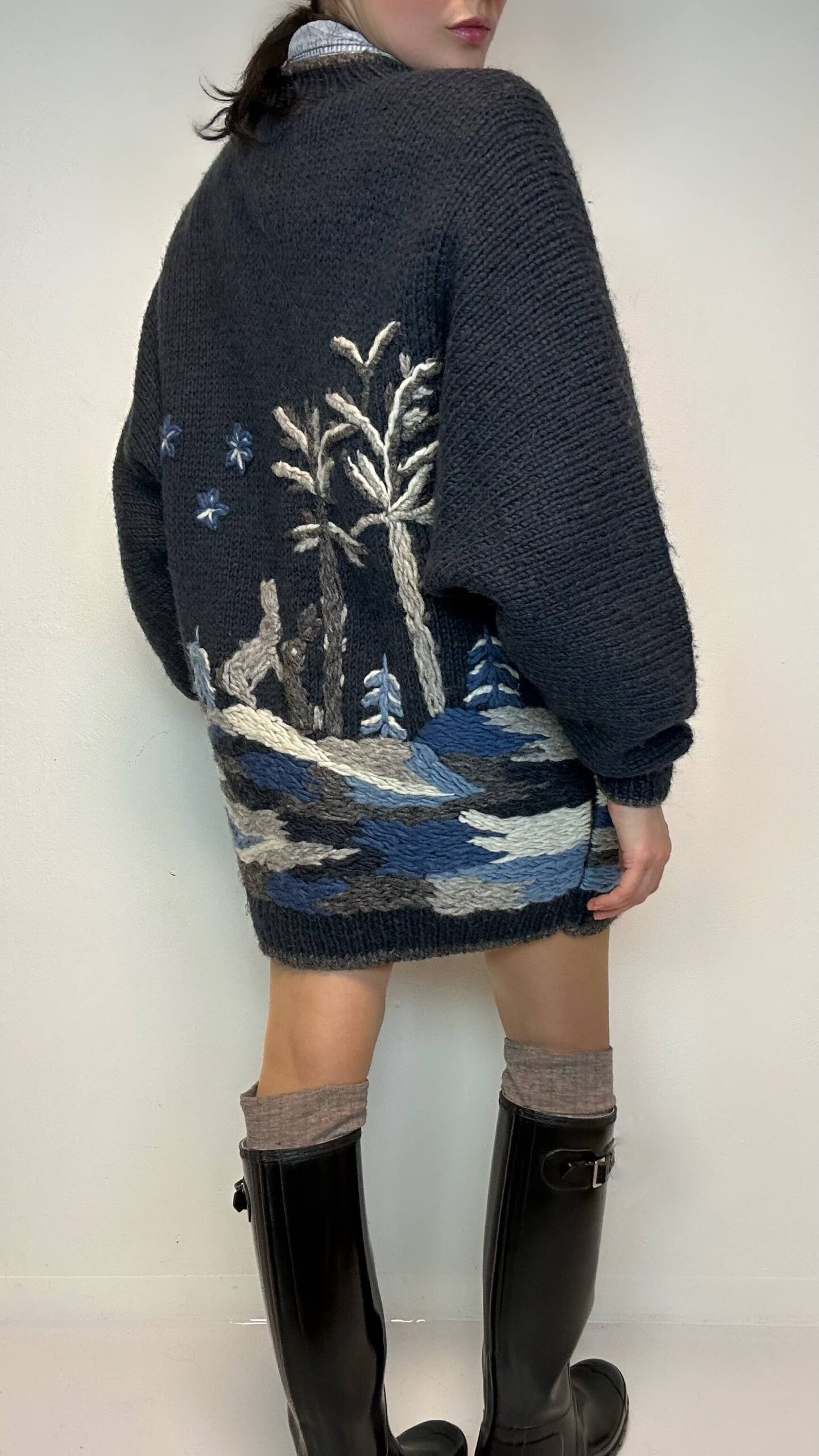 Rare woolen hand-knitted cardigan with rabbits in a winter scenery