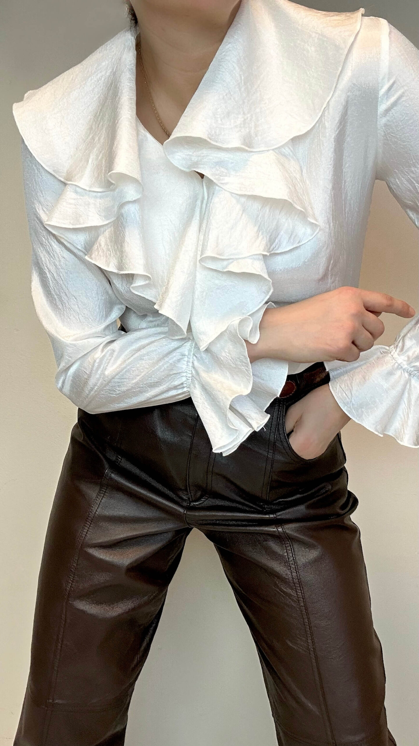 White blouse with a cascade collar and poet sleeves