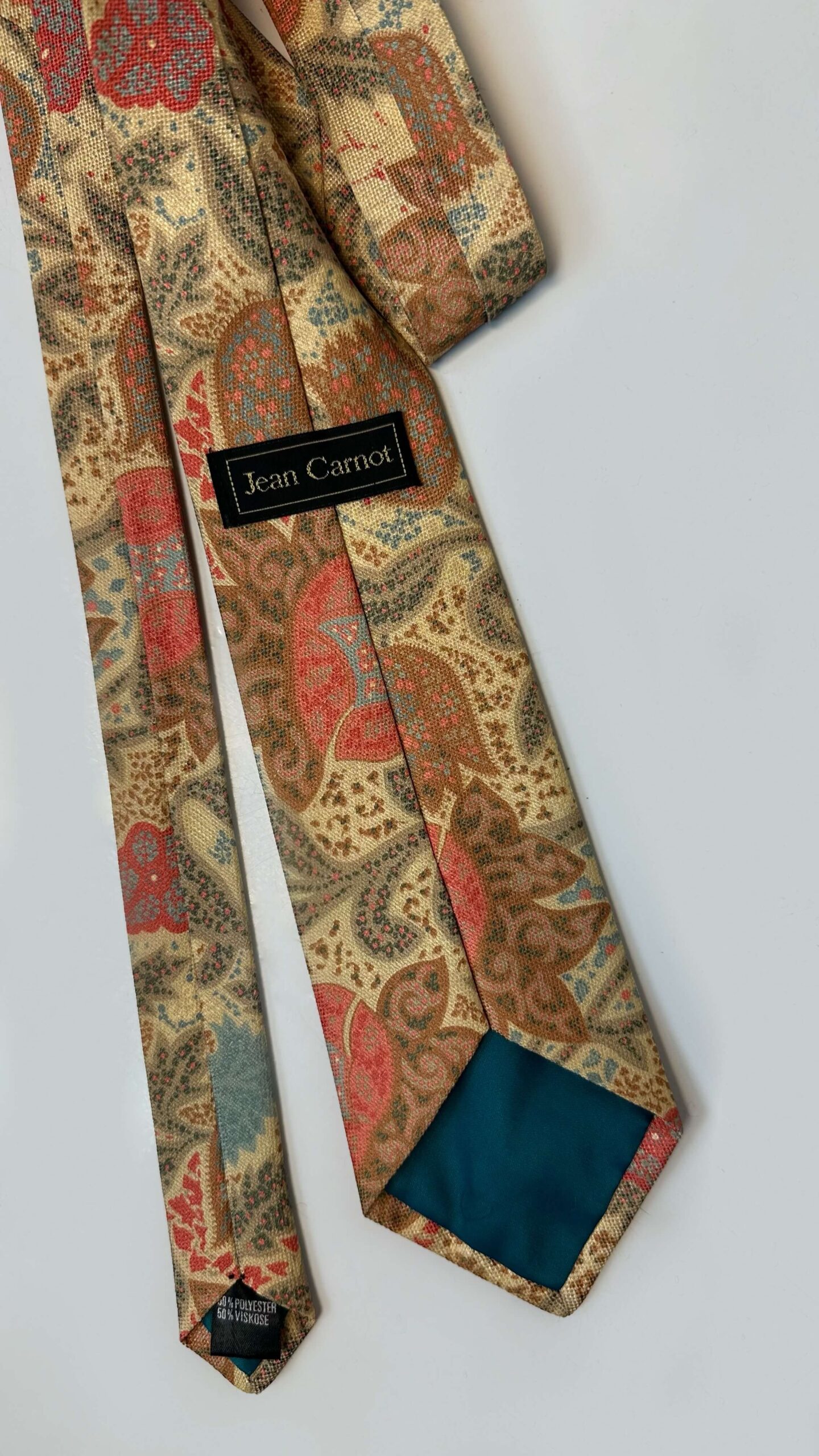 Necktie in a paisley warm, earthy tones pattern